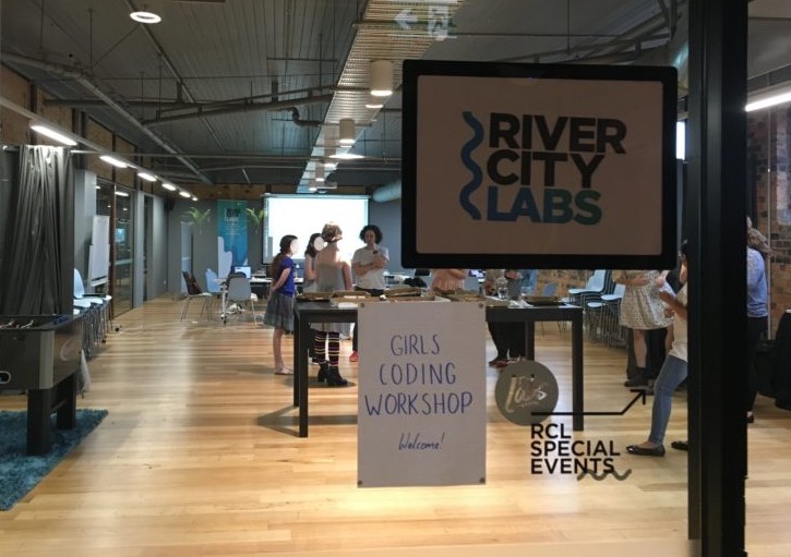 The view into River City Labs where the Brisbane girls coding workshop was held, with the girls and leaders chatting at the pizza lunch